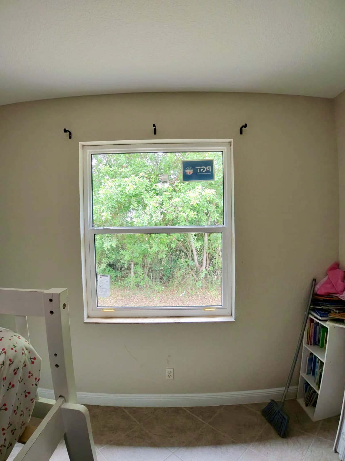 New PGT hurricane-impact single-hung window installed in a Tampa Bay bedroom